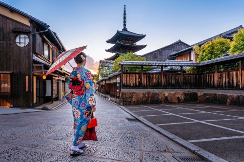 Woman Wearing Japanese Traditional Kimono With Umbrella At Yasaka Pagoda And Sannen Zaka Street In Kyoto, Japan.