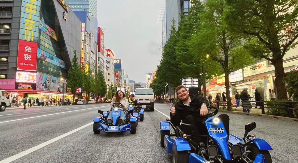 Two Young People Go-karting Through The Streets Of Tokyo On A Custom Japan Tour