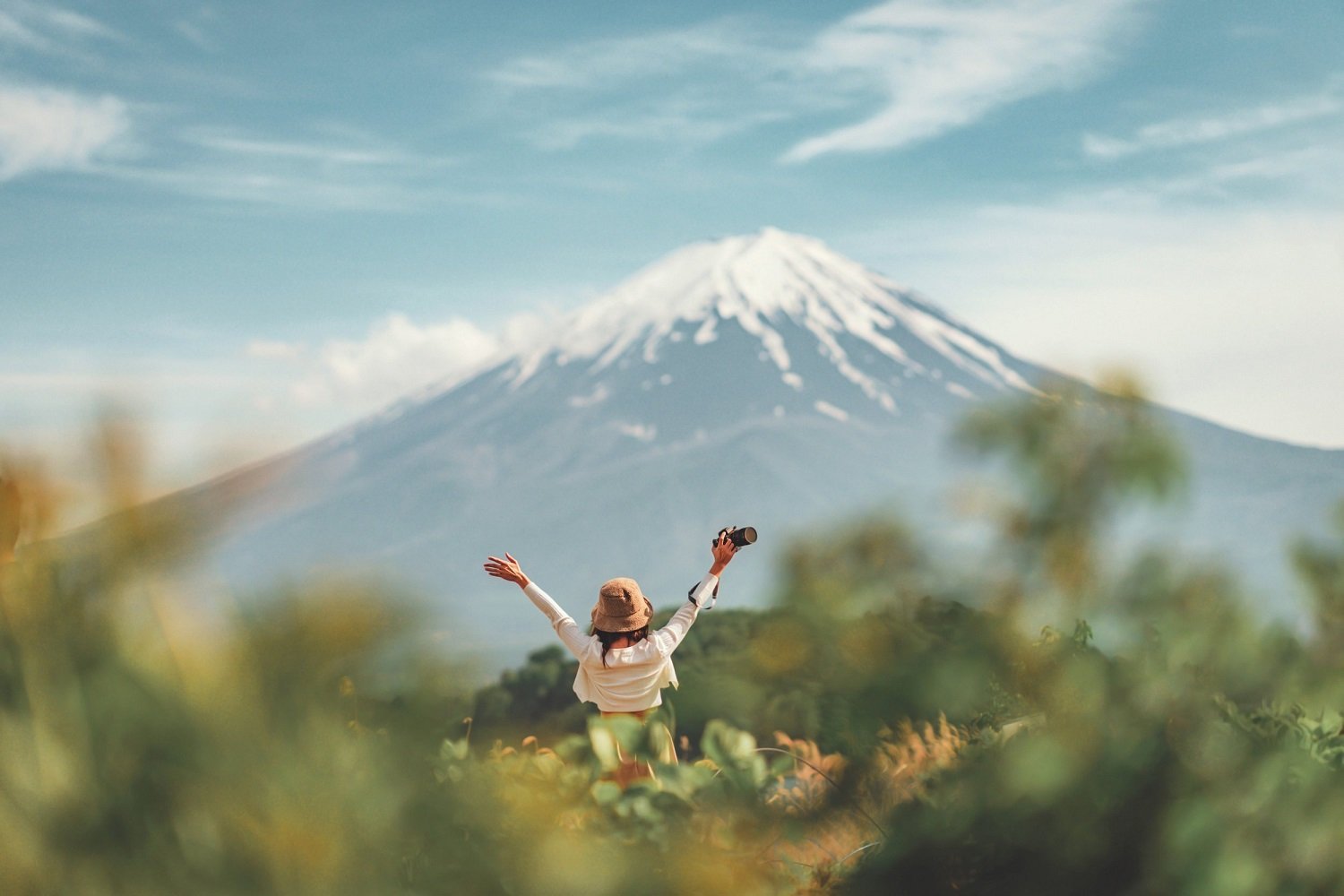 Happy Tourist Traveler Woman Enjoying With Open Arms On Lake
